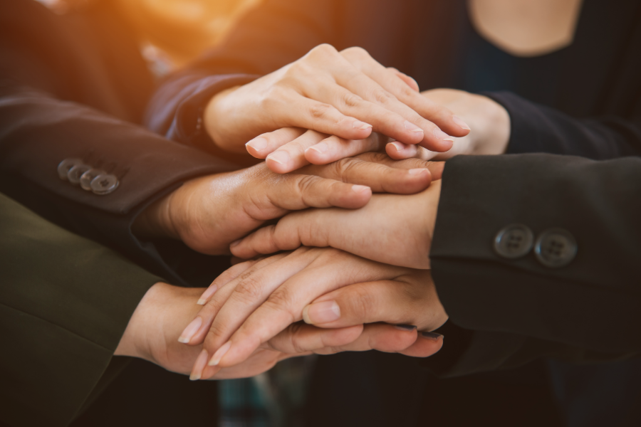 Hand pile symbolizing teamwork