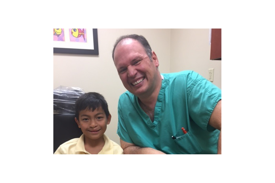 Doctor with kid at Arnold Palmer